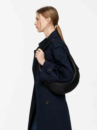 Mellemstørrelse buet skuldertaske