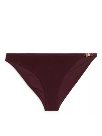 Bikiniunderdel med perledetaljer