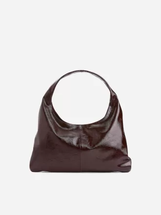 Skinnende lædertaske