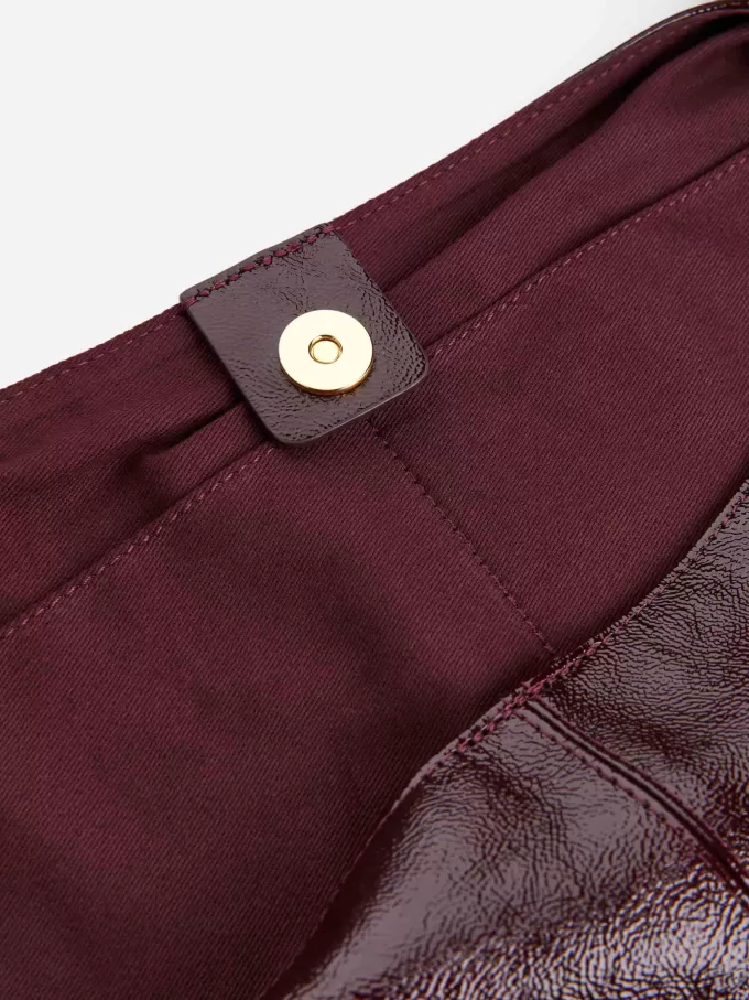 Skinnende lædertaske